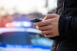 man using cell phone with Immigration police